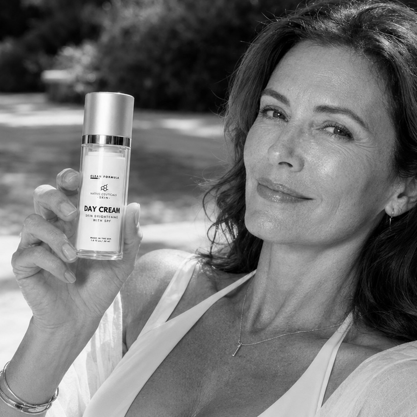 Woman holding Native Ceuticals Day Cream